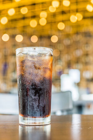 cola glass on bokehの写真素材