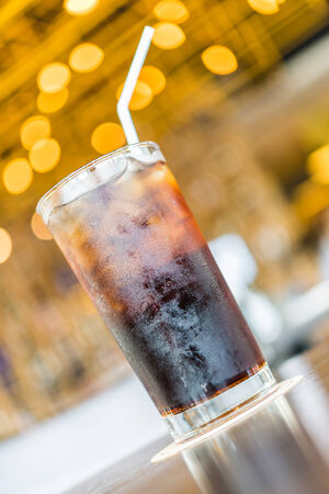 Cola glass on bokeh backgroundの写真素材