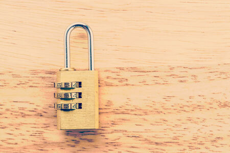 Key pad lock on wooden background process vintage style pictureの写真素材