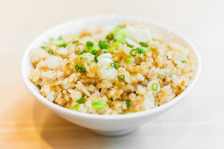 Fried garlic rice in white bowl - japanese style foodの写真素材