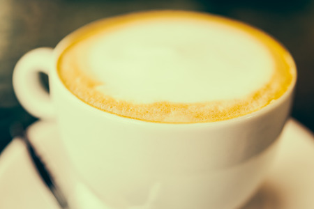 latte coffee in white cup - vintage effect style picturesの写真素材