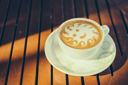 Latte art coffee cup in white mug - vintage effect style picturesの写真素材