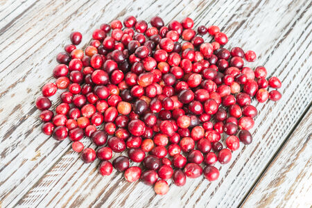 Cranberry on wooden background