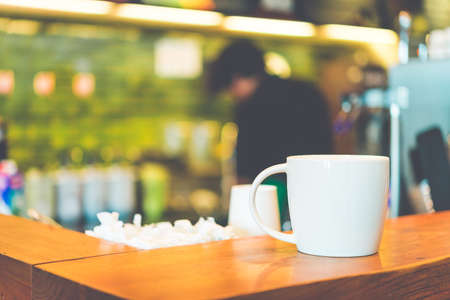 Coffee cup in coffee shop - vintage style effect pictureの写真素材