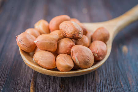 Peanut on wooden background - vintage effect style picturesの写真素材
