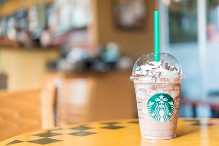 Bangkok ,Thailand- OCT 30 : Frappuccino Chocolate Blended Beverages served at wood table in starbuck shop at Central Department store Rattatibet , Bangkok, Thailand.のeditorial素材