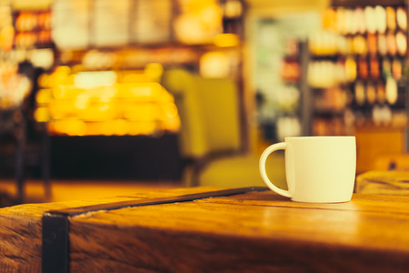 Latte coffee cup on table in coffee shop - Vintage old effect processing picture style
