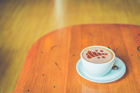 Latte coffee cup in coffee shop - process vintage effect style picturesの写真素材