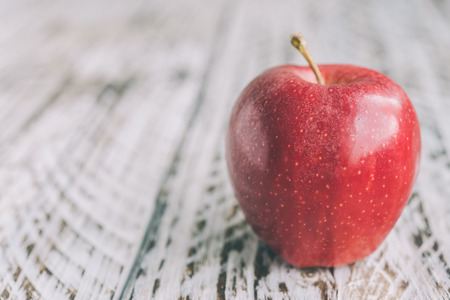 Apple on wooden background - processing still life effect style picutresの写真素材