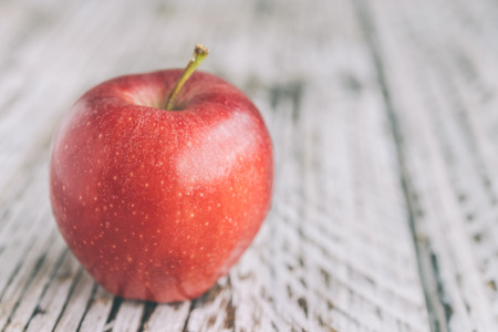 Apple on wooden background - processing still life effect style picutresの写真素材
