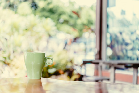 Latte coffee cup in coffee shop - process vintage effect style picturesの写真素材