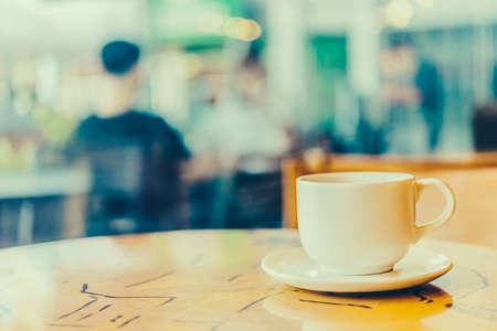 Black coffee in white cup on wooden table in coffee shop cafe - Vintage effect style picturesの写真素材