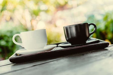 Coffee mug on wooden table - Vintage effect style picturesの写真素材