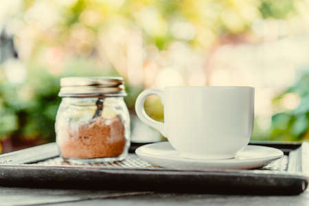 Coffee mug on wooden table - Vintage effect style picturesの写真素材