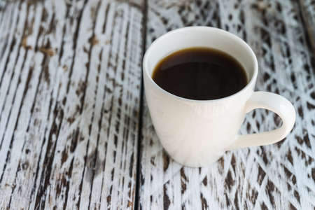 White coffee mug on wood backgroundの写真素材