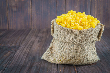 raw pasta on wooden - process old dark style pictureの写真素材
