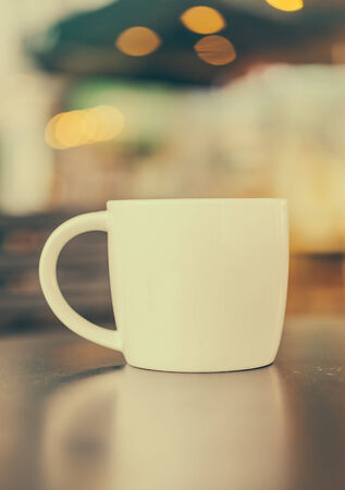 Coffee cup in coffee shop cafe - vintage effect style picturesの写真素材