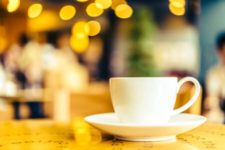 Coffee cup on wooden table - Vintage effect style picturesの写真素材