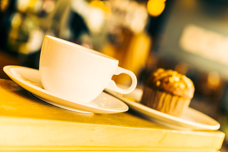Coffee cup on wooden table in coffee shop - Vintage effect style picturesの写真素材