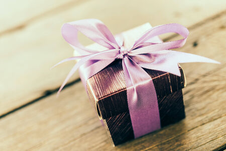 Gift box on wooden table - Vintage effect style picturesの写真素材