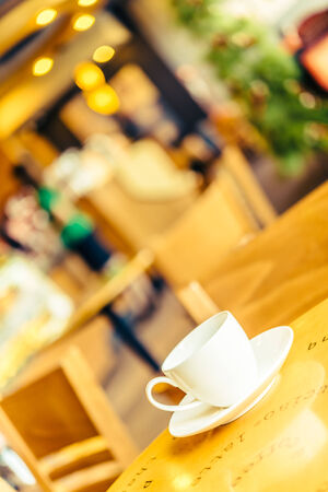 Coffee cup on wooden table - Vintage effect style picturesの写真素材