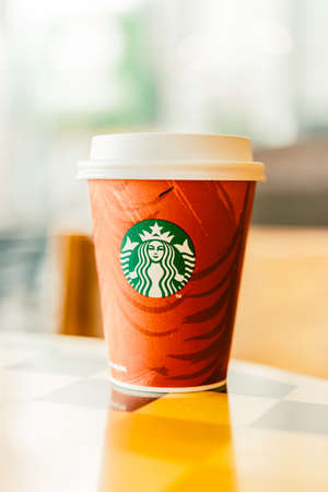 BANGKOK, THAILAND - Dec 09, 2014: Starbucks Coffee cup at Central department store in Thailand. Starbucks is the world's largest coffee house with over 20,000 stores in 61 countries.のeditorial素材
