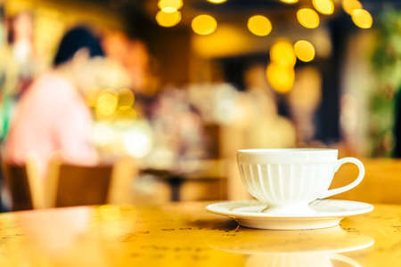Coffee cup on wooden table - Vintage effect style picturesの写真素材