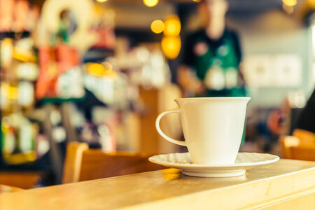Coffee mug in coffee shop - Vintage effect style picturesの写真素材