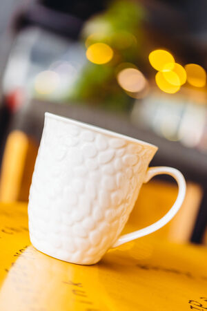 Coffee cup in coffee shop on wooden table - Vintage effect style picturesの写真素材