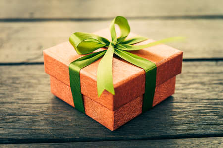 Christmas Gift box on wooden background - Vintage effect style picturesの写真素材