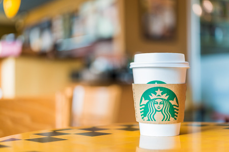 Bangkok ,Thailand- OCT 30 : Hot coffee cup Blended Beverages served at wood table in starbuck shop at Central Department store Rattatibet , Bangkok, Thailand.のeditorial素材
