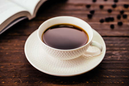 Black coffee cup on wooden background - Vintage effect style picturesの写真素材