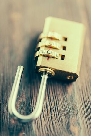 close up pad lock on wooden - vintage effect style pictures