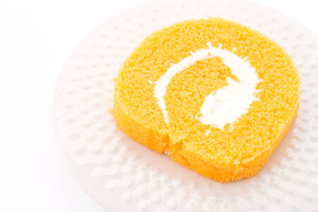 jam roll cake isolated on whiteの写真素材