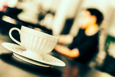 Black coffee in white cup in coffee shop - Vintage effect pictures styleの写真素材