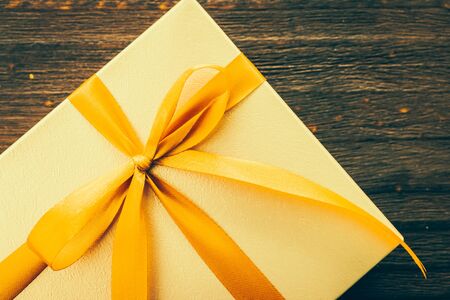 Gift box on wood background - vintage effect style picturesの写真素材