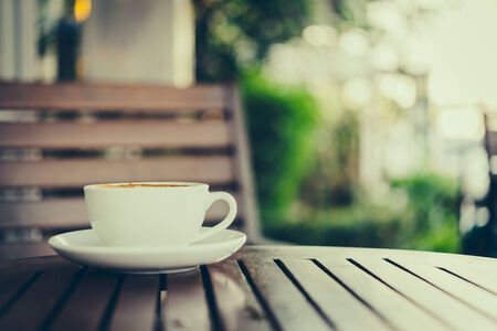 Latte art coffee cup in white mug - vintage effect style picturesの写真素材