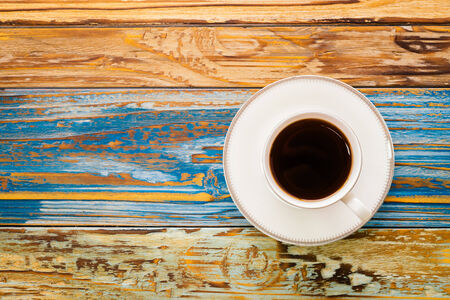 Coffee cup on wooden table - Vintage effectの写真素材