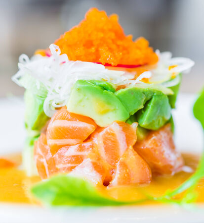 Tartar salmon with avocado salad - japanese food styleの写真素材