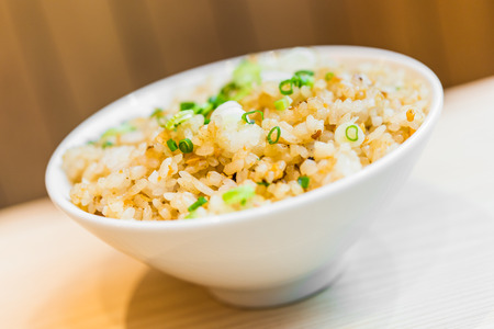 Fried garlic rice in white bowl - japanese style foodの写真素材