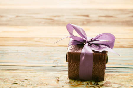 Gift box on wooden background - vintage effect style picturesの写真素材