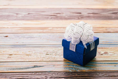 Gift box on wood background - vintage effect style picturesの写真素材