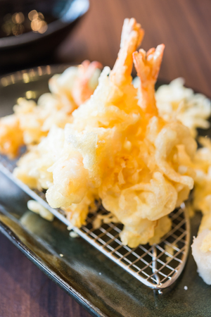 Tempur prawn - fried shrimp japanese style in black plate on wooden tablesの写真素材