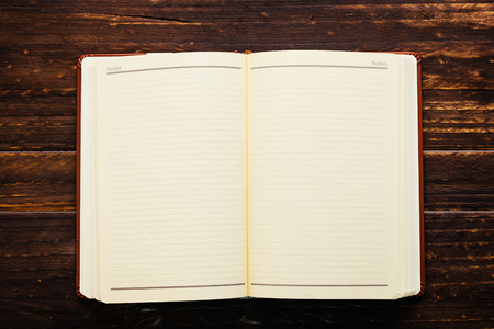 Note book on wooden background - Vintage effect style pictures