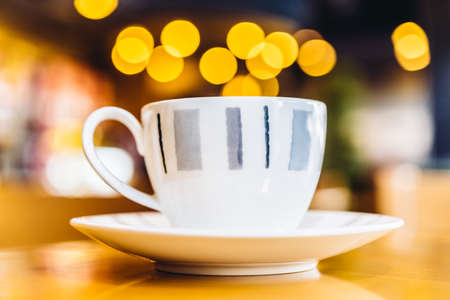 Coffee cup on wood table - vintage effect style picturesの写真素材