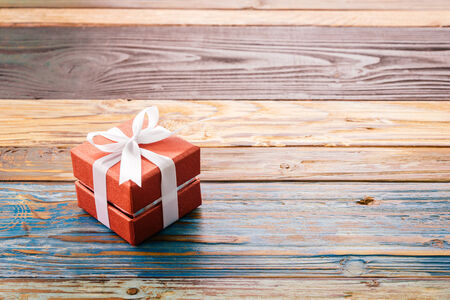 Gift box on wood background - vintage effect style pictures
