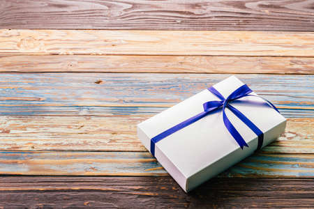 Gift box on wood background - vintage effect style picturesの写真素材