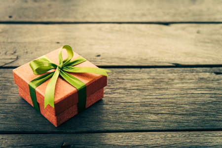 Christmas Gift box on wooden background - Vintage effect style picturesの写真素材