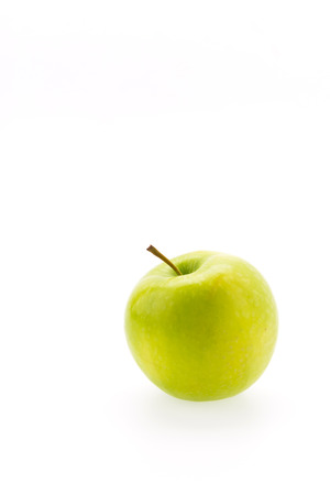Green apple isolated on whiteの写真素材