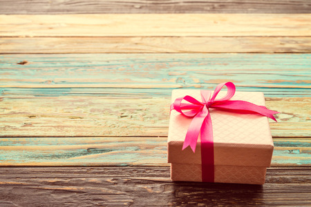 Gift box on wooden background - vintage effect style picturesの写真素材